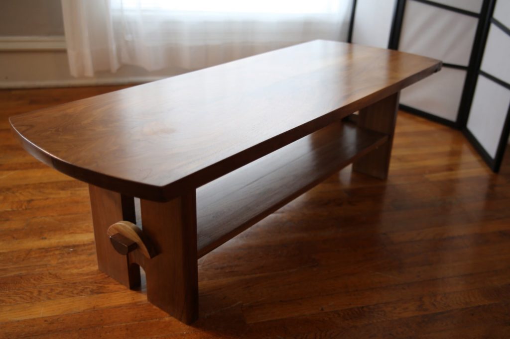Coffee Table Made from walnut with “bookmatched” top, “notch and pin” joinery.